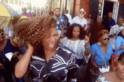 Woman With Curly Hair Dancing In Crowd GIF