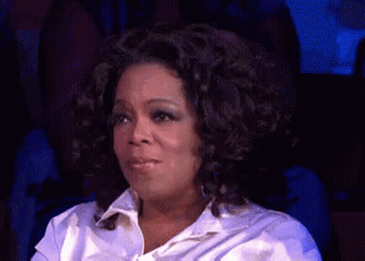 Woman With Curly Hair Funny Face In Dark Room GIF