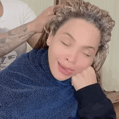 Woman With Curly Hair Getting Hair Dyed GIF