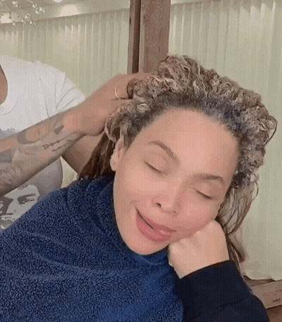 Woman With Curly Hair Getting Hair Dyed GIF