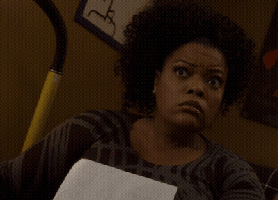 Woman With Curly Hair Holding Paper GIF