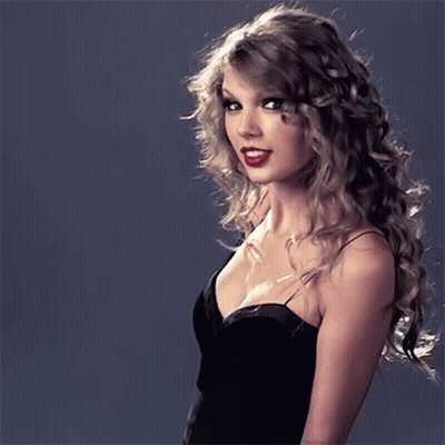 Woman With Curly Hair In Black Dress GIF