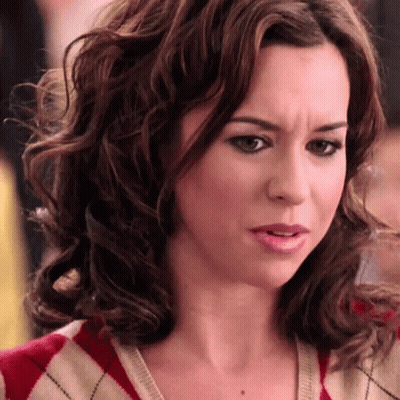 Woman With Curly Hair In Red And White Sweater GIF