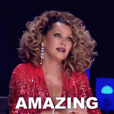 Woman With Curly Hair In Red Sequin Top GIF