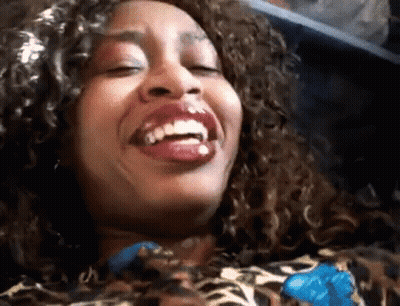 Woman With Curly Hair Laughing Eyes Closed GIF