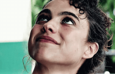 Woman With Curly Hair Looking Up GIF