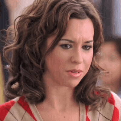 Woman With Curly Hair Making Funny Face GIF