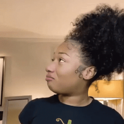 Woman With Curly Hair Making Funny Face GIF