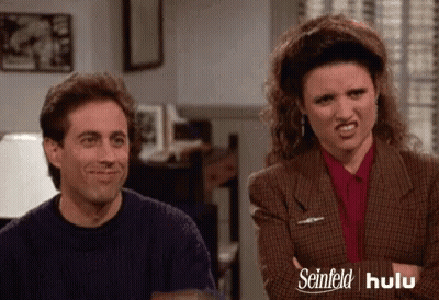 Woman With Curly Hair Necklace Says Chuckles Laughable GIF