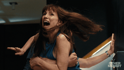 Woman With Curly Hair Saying Blocked GIF