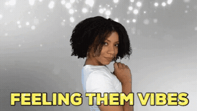 Woman With Curly Hair Saying Feeling Them Vibes GIF