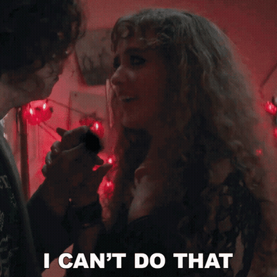 Woman With Curly Hair Says I Can't Do That Holding Man's Hand GIF