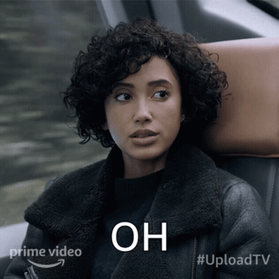 Woman With Curly Hair Sitting In Car Saying Oh GIF