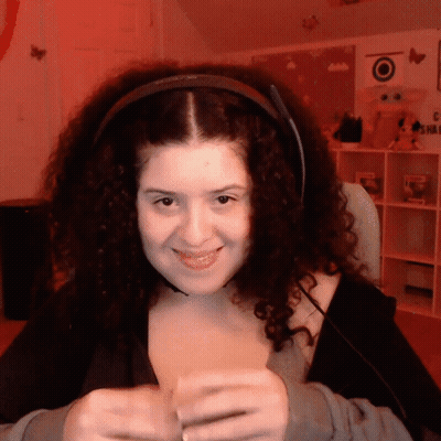 Woman With Curly Hair Smiling In Headphones GIF