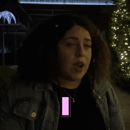 Woman With Curly Hair Standing In Front Of Recognize Sign GIF