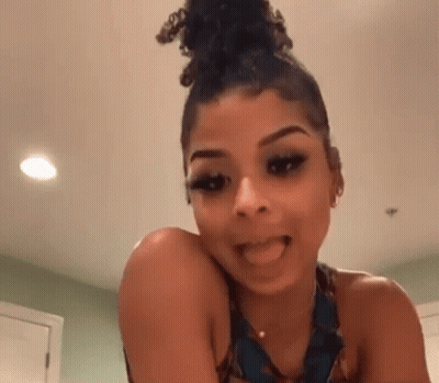 Woman With Curly Hair Sticking Tongue Out GIF