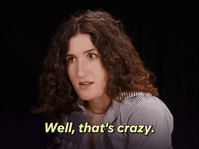 Woman With Curly Hair Talking Into Microphone Says Well That's Crazy GIF