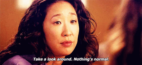 Woman With Curly Hair Talking To Another Woman Says Take A Look Around Nothing's Normal GIF