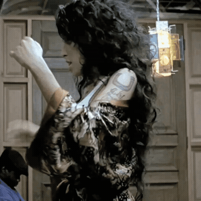 Woman With Curly Hair Tattoo Saying I Love You GIF