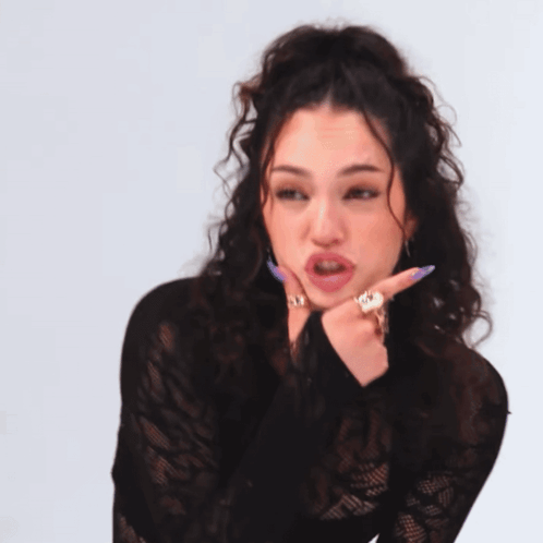 Woman With Curly Hair Wearing Black Lace Shirt GIF