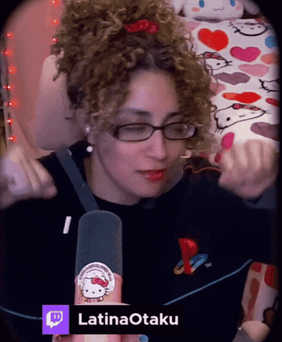 Woman With Curly Hair Wearing Glasses And Hello Kitty Sticker GIF