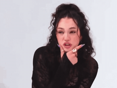 Woman With Curly Hair Wearing Lace Top GIF