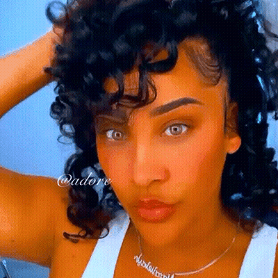Woman With Curly Hair Wearing Necklace Saying Nicole Williams GIF