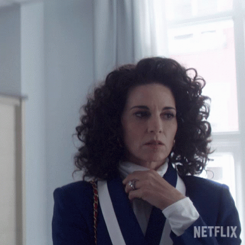 Woman With Curly Hair Wearing Netflix Logo Jacket GIF