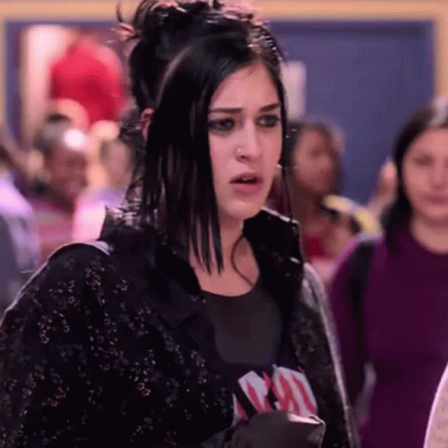 Woman With Dark Hair And Nose Ring In Crowd GIF