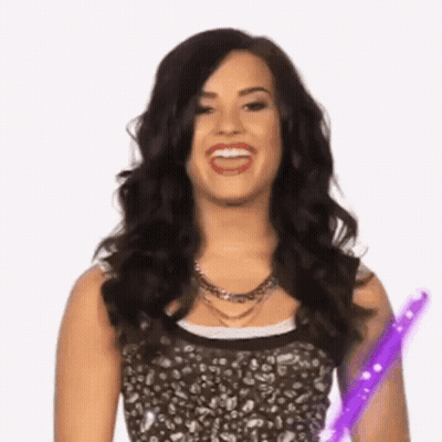 Woman With Dark Hair Holding Purple Wand GIF