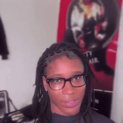 Woman With Dreadlocks And Glasses Making Funny Face GIF