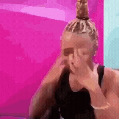 Woman With Dreadlocks Covering Face GIF