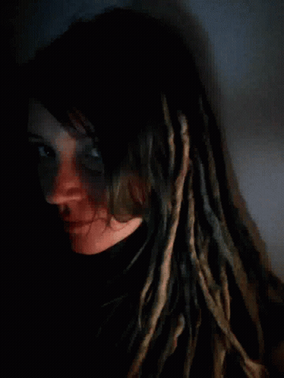 Woman With Dreadlocks Lying Down GIF