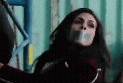 Woman With Duct Tape On Mouth On Scaffolding GIF
