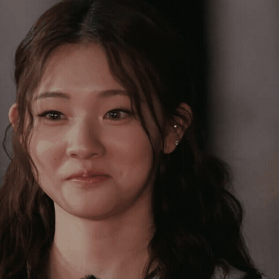 Woman With Ear Piercing Looking At Camera GIF