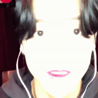 Woman With Earbuds Close Up GIF