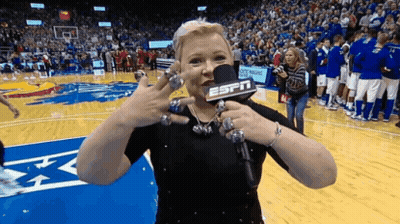 Woman With ESPN Microphone On Basketball Court GIF