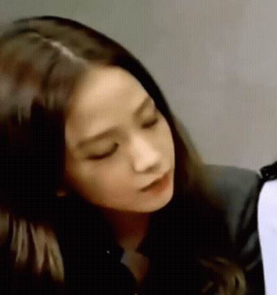 Woman With Eyes Closed And Black Jacket GIF