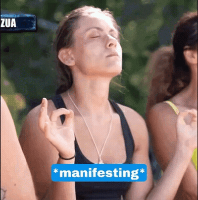 Woman With Eyes Closed And Blue Manifesting Sign GIF