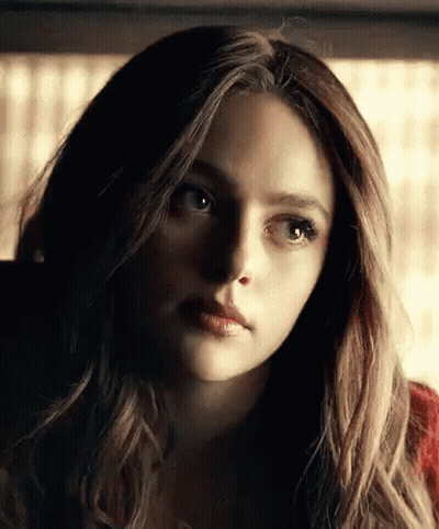Woman With Eyes Closed And Hair Blowing In Wind GIF