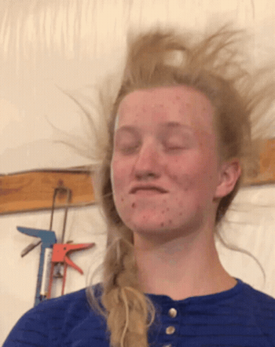 Woman With Eyes Closed And Hair Blowing GIF