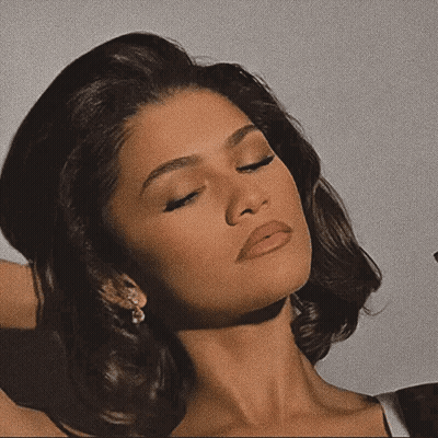 Woman With Eyes Closed And Hair In Hand GIF