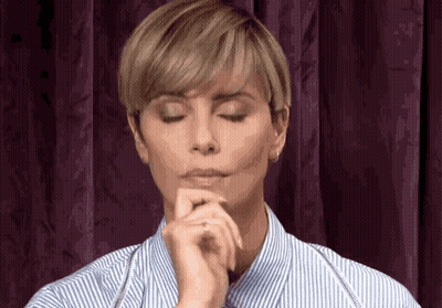 Woman With Eyes Closed And Hands On Chin GIF