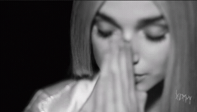 Woman With Eyes Closed And Hands On Face GIF