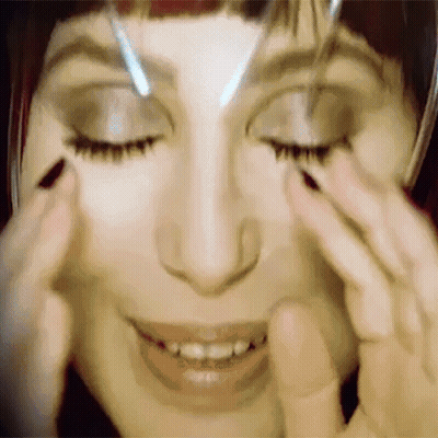 Woman With Eyes Closed And Hands On Face GIF