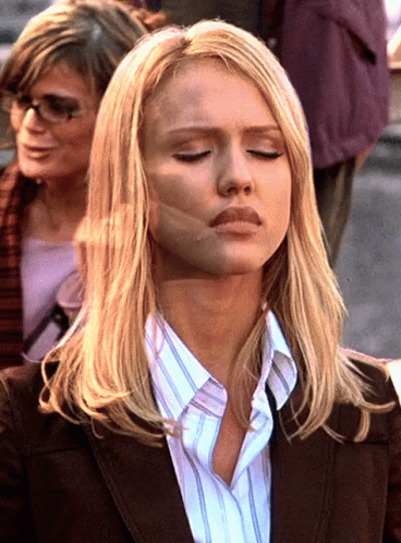 Woman With Eyes Closed And Striped Shirt GIF