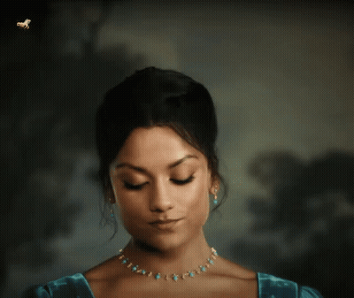 Woman With Eyes Closed And Turquoise Necklace And Earrings GIF