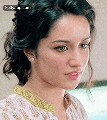 Woman With Eyes Closed And Yellow Collar GIF