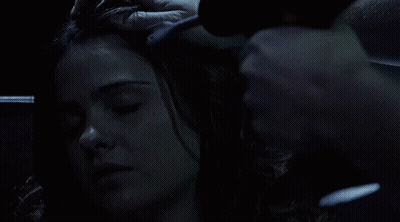 Woman With Eyes Closed Being Brushed GIF