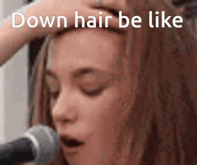 Woman With Eyes Closed Hand To Forehead In Front Of Microphone Saying Down Hair Be Like GIF
